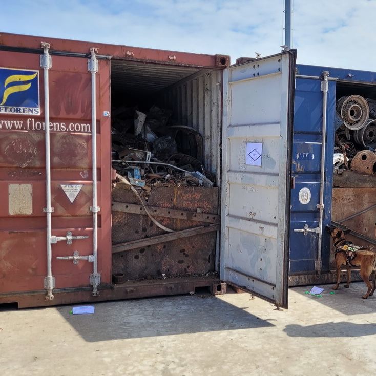 Scrap metal containers stacked at a processing facility
